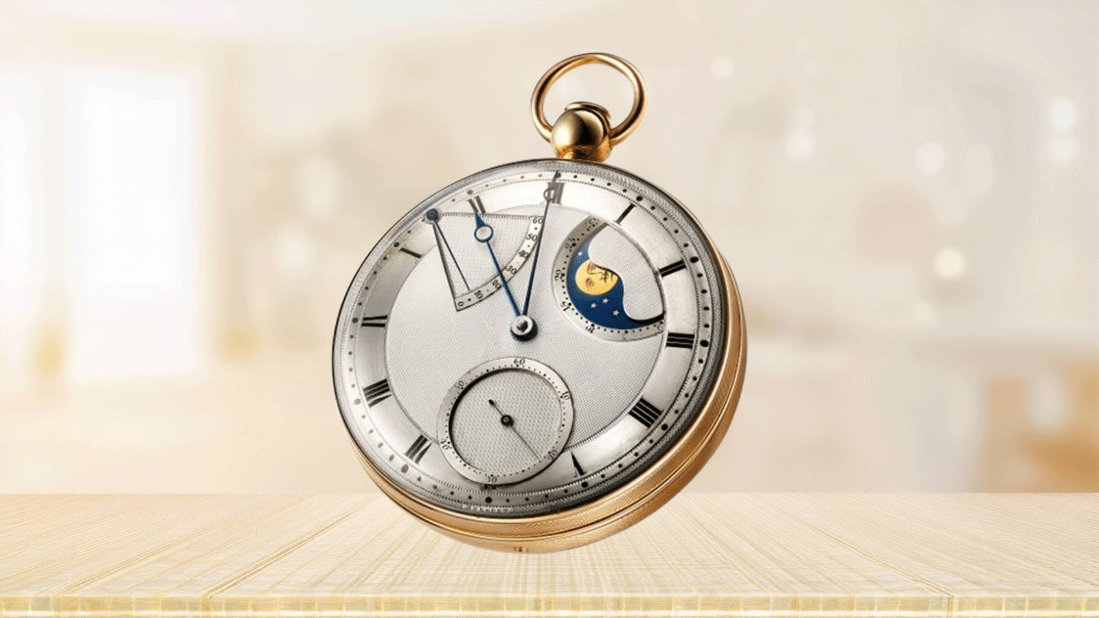 The Breguet No. 5 - Perpétuelle pocket watch with "à toc" quarter repeater in 18K yellow gold. Dial in silvered gold, engine-turned by hand, with recessed subdial for the seconds. 60-hour power-reserve indicator and display of the phases and age of the moon. Chapter ring with Roman numerals engraved and painted black by hand.